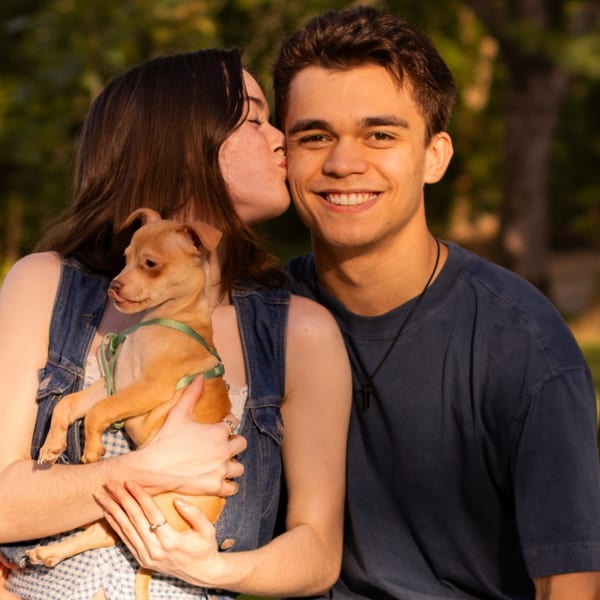 Isaah Jacob outdoors with his girlfriend and their dog